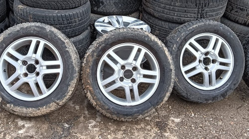 Set jante aliaj Ford Focus 98AB-DA 6JX15H2 + anvelope / cauciucuri iarna M+S 195/65/R15 stare foarte buna